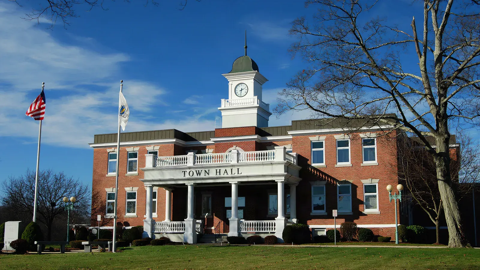 Randolph Town Hall, a red-brick building with a white columned portico and clock-tower cupola, Randolph, Massachusetts